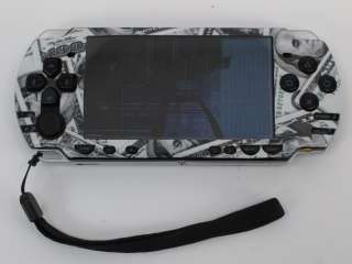 Black Sony PSP 2000 with a hundred dollar bill skin applied (for parts 