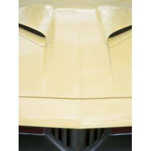 Close Up of the Front View of the Grill and Hood of a Vintage Yellow 