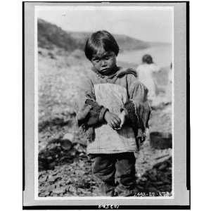  Photo Eskimo boy wearing ragged clothing made from flour 