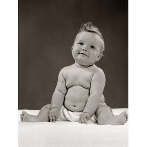 Portrait of Baby Sitting With Legs Outstretched Smiling Indoor 