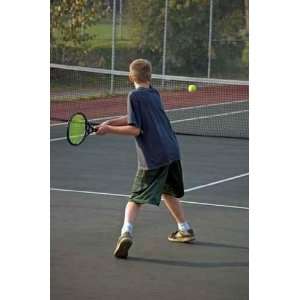  A Teenage Boy Prepares to Backhand the Tennis Ball   Peel 