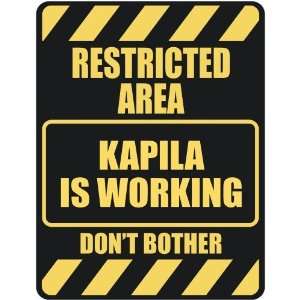   RESTRICTED AREA KAPILA IS WORKING  PARKING SIGN