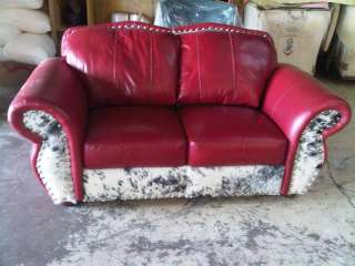 RED COLCHESTER LOVESEAT w/ BLACK AND WHITE COWHIDE  