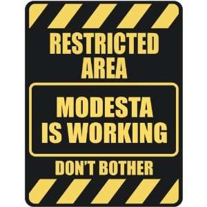   RESTRICTED AREA MODESTA IS WORKING  PARKING SIGN