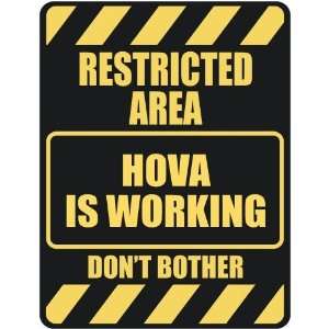   RESTRICTED AREA HOVA IS WORKING  PARKING SIGN