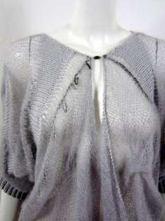 Cardigan style 3/4 length sleeves with ribbed band Single magnet 