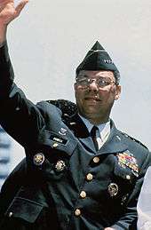 General Colin Powell, Chairman, Joint Chiefs of Staff, waves from his 