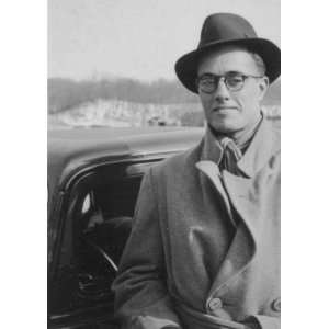  John A. Lomax, Jr. standing next to car, facing 