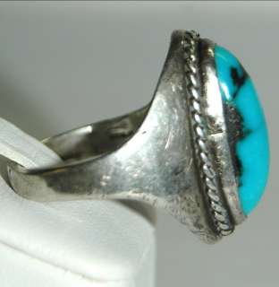   is an Elongated Turquoise Cabochon set in Sterling Silver Ring