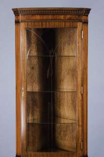   this corner cabinet off with its etched glass door and glass shelves
