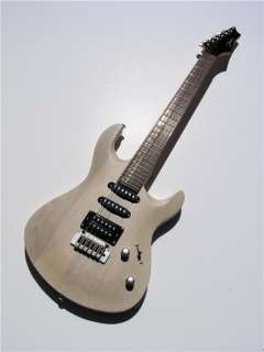   guitar with an open pore oiled finish and brushed aluminum hardware