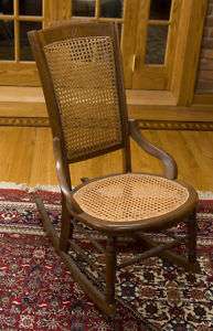 ANTIQUE ROCKING CHAIR W/ CANE SEAT AND BACK  